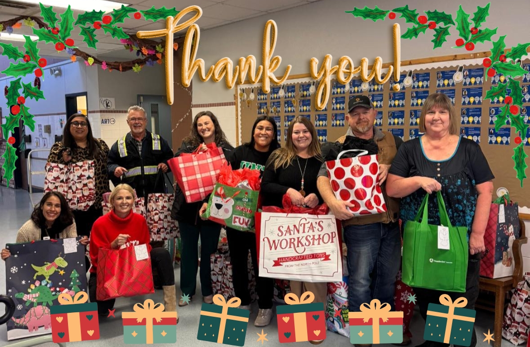 Staff posing with holiday gifts